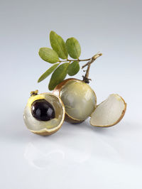 Close-up of fruit against white background