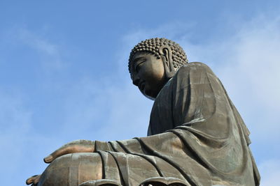 Low angle view of statue against sky