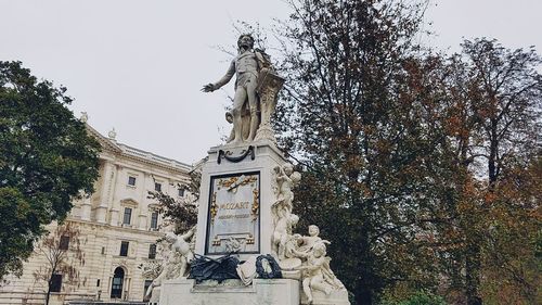 Low angle view of statue against sky