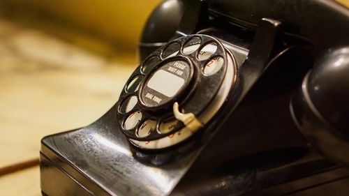 High angle view of old camera on table