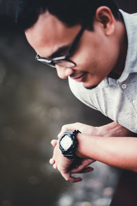 Close-up of man checking time