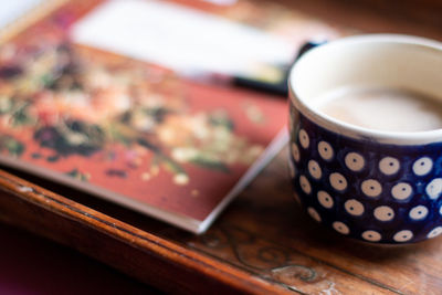 Close-up of coffee cup on table