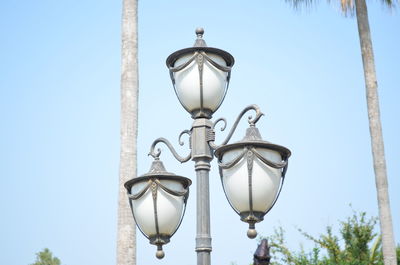 Low angle view of street light against sky