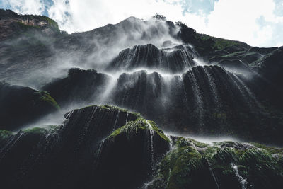 Low angle view of waterfall