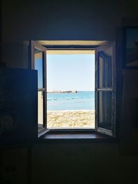 Scenic view of sea seen through window