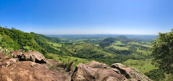 Scenic view of landscape against clear blue sky