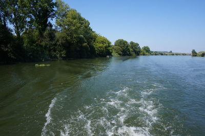 Scenic view of calm sea against clear sky