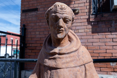 Close-up of statue against building