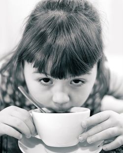 Close-up of a boy drinking coffee