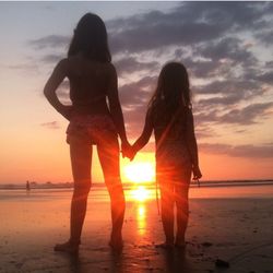 Couple at beach during sunset