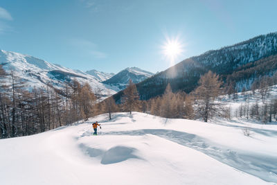 Scenic view of snow covered mountains against sky