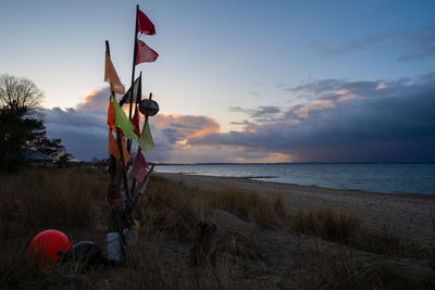 Scenic view of beach against sky during sunset