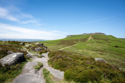 Ancient iron age hill fort carl wark from higger tor in the peak district national park, derbyshire.