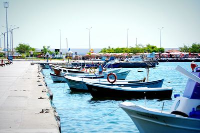 Boats moored in water