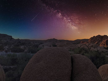 Joshua tree national park in california. rocks on the dessert at night with milky way view and stars