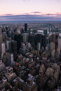 High angle view of modern buildings in city against sky