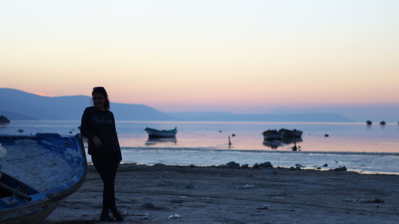 sunset, sea, water, beach, horizon over water, nautical vessel, scenics, clear sky, tranquil scene, beauty in nature, transportation, tranquility, orange color, silhouette, boat, shore, copy space, sky, nature