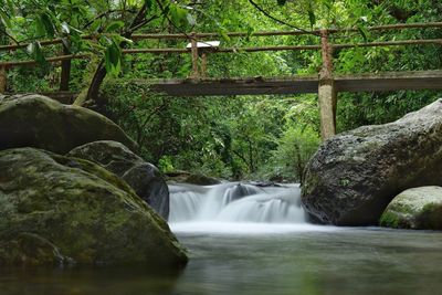 Scenic view of river flowing through rocks