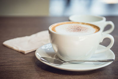 Close-up of coffee cup on table