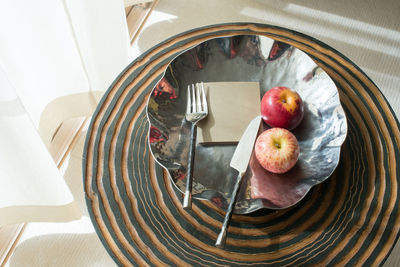 High angle view of fruits in plate on table