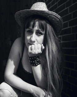 Portrait of young woman in hat