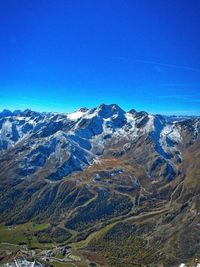 Scenic view of snowcapped mountains against clear sky