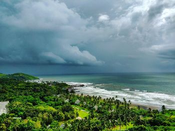 Scenic view of sea against storm clouds