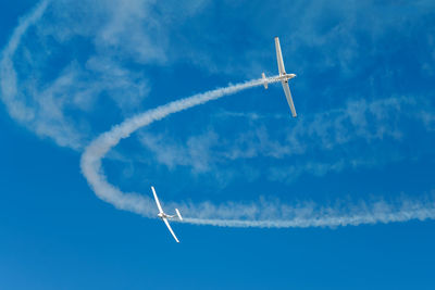 Low angle view of airplane flying in sky