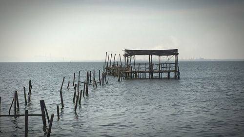 Lifeguard hut in sea against clear sky