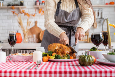 Happy thanksgiving day. autumn feast. woman celebrating holiday cooking traditional dinner