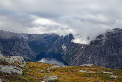 Scenic view of waterfall against sky