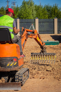 Rear view of man working at construction site