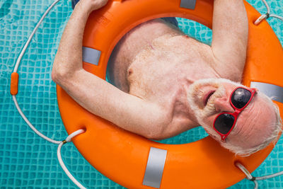 Low angle view of woman sitting in slide