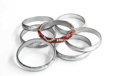 High angle view of wedding rings on white background