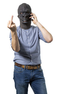 Portrait of man standing against white background