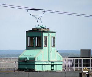 Overhead cable car against sky