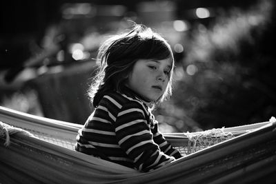 Girl in hammock looking away