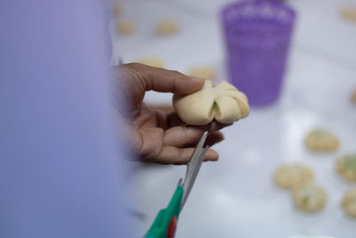 Close-up of hand holding ice cream