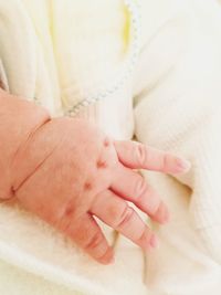 Close-up of couple holding hands