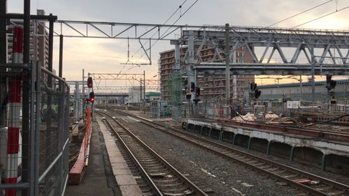 Train at railroad station against sky