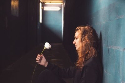 Young woman with flowers in hair