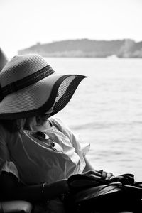 Portrait of woman sitting in sea