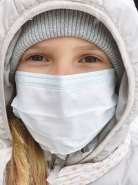 Close-up of girl wearing mask 