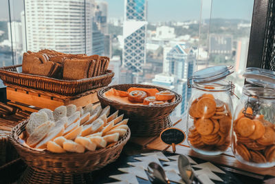 Close-up of cakes in basket high above the city