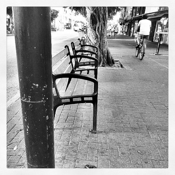 transfer print, auto post production filter, shadow, building exterior, built structure, street, architecture, sunlight, incidental people, sidewalk, day, outdoors, tree, chair, table, footpath, person, bench, men