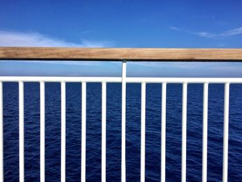 Close-up of railing against sea