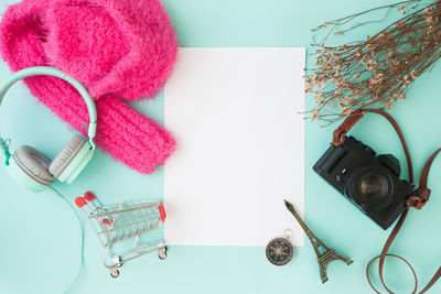 High angle view of camera on table against white background