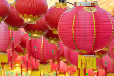 Low angle view of illuminated lanterns hanging at night