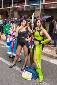 Women standing on street in city