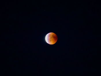 Low angle view of moon against sky at night